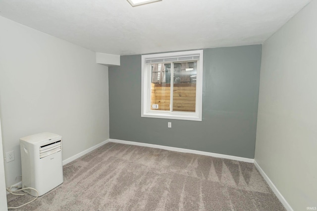 unfurnished room with light colored carpet