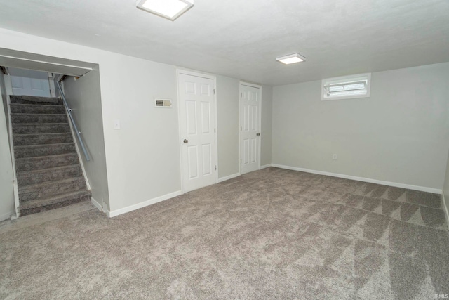 basement featuring carpet flooring