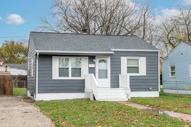 bungalow-style home featuring a front yard