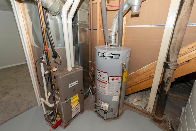 utility room featuring heating unit and gas water heater