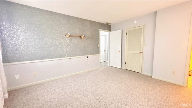 spare room featuring carpet flooring