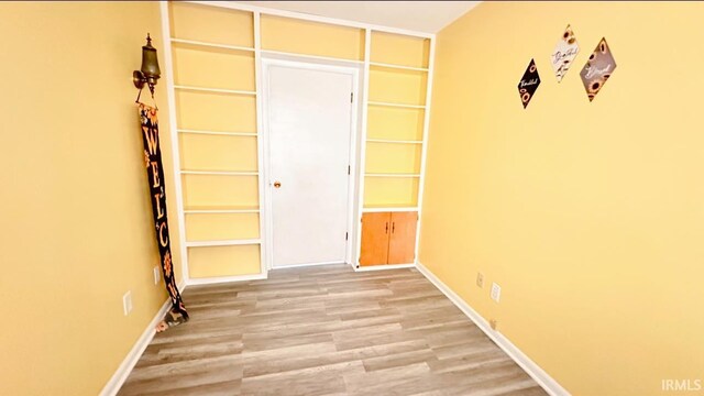 empty room featuring wood-type flooring