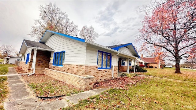 view of property exterior with a yard