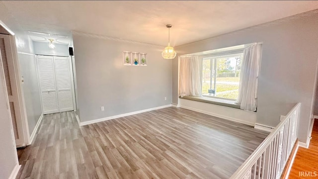 unfurnished room featuring wood-type flooring