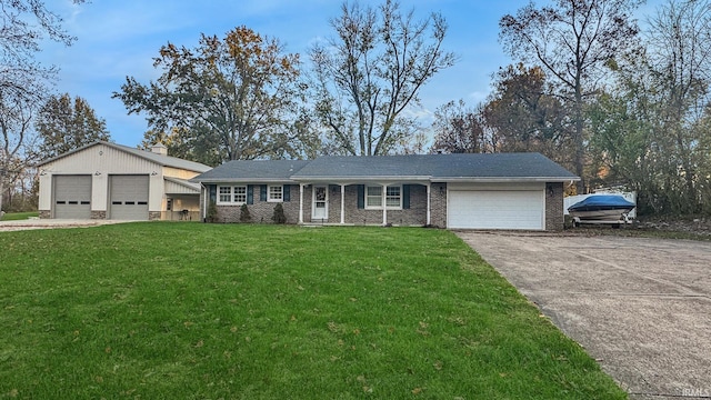 ranch-style house with a garage and a front lawn