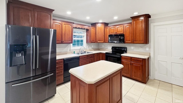 kitchen with black appliances, sink, ornamental molding, light tile patterned floors, and a kitchen island