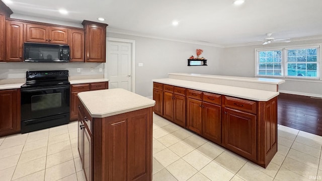 6777 Oak Grove Rd, Newburgh, IN 47630 - kitchen featuring black appliances, a kitchen island, light countertops, ornamental molding, and ceiling fan