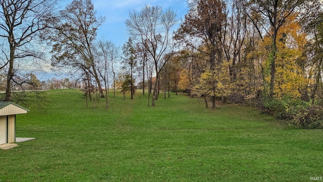 6777 Oak Grove Rd, Newburgh, IN 47630 - view of green lawn with a detached garage