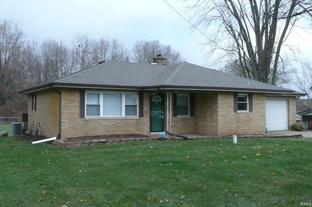 view of front of property with cooling unit, a front lawn, and a garage