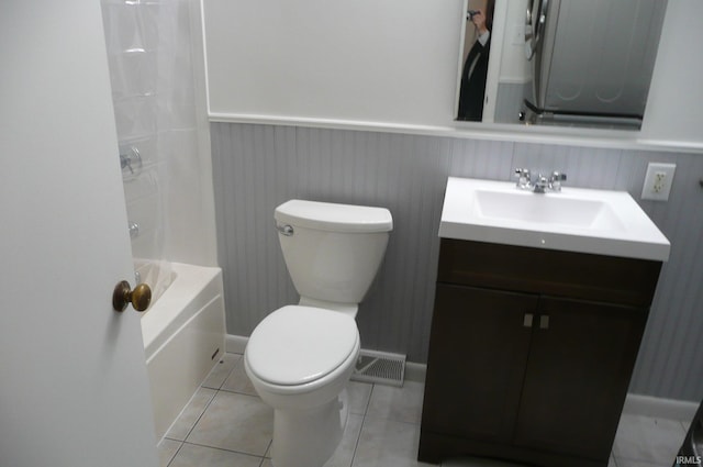 full bathroom featuring tile patterned flooring, vanity, toilet, and shower / bathtub combination