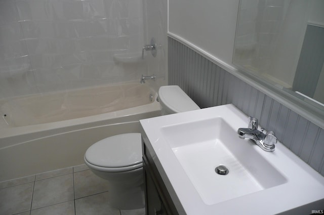 full bathroom featuring tile patterned floors, sink, bathtub / shower combination, and toilet