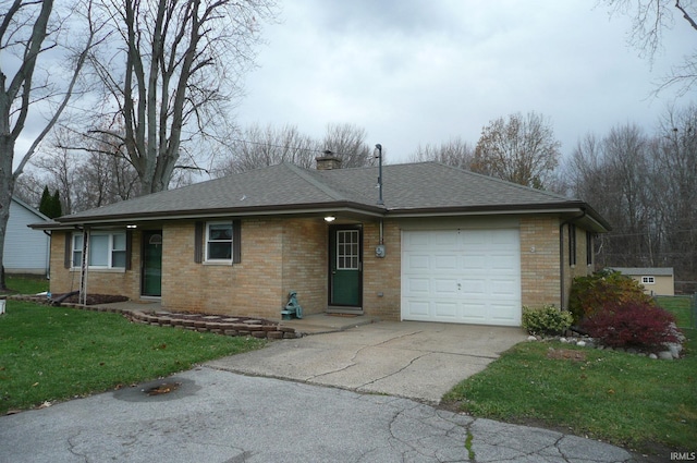 ranch-style house featuring a garage and a front yard