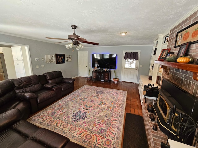 living room featuring a textured ceiling, ceiling fan, and crown molding