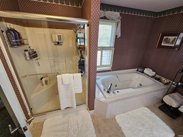 bathroom with tile patterned floors and independent shower and bath