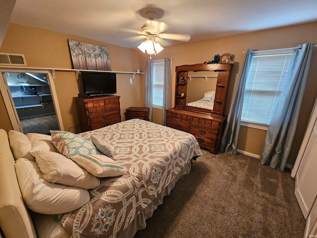 carpeted bedroom featuring ceiling fan and multiple windows