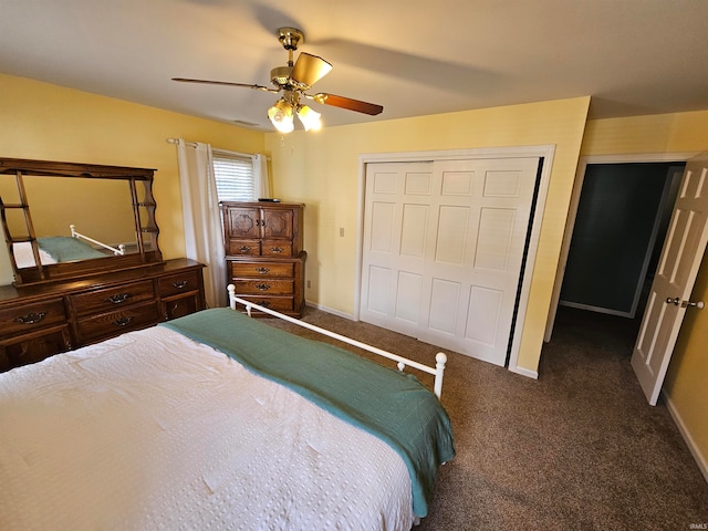 carpeted bedroom with a closet and ceiling fan