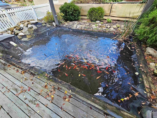 view of swimming pool with a wooden deck