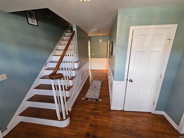 stairs featuring hardwood / wood-style floors