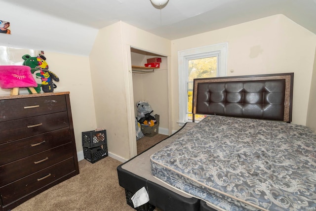 bedroom with light colored carpet and a closet