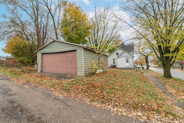 exterior space featuring an outbuilding and a garage