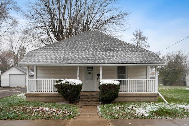 bungalow-style home with an outbuilding and a garage