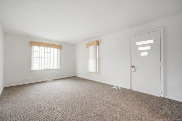 view of carpeted entrance foyer