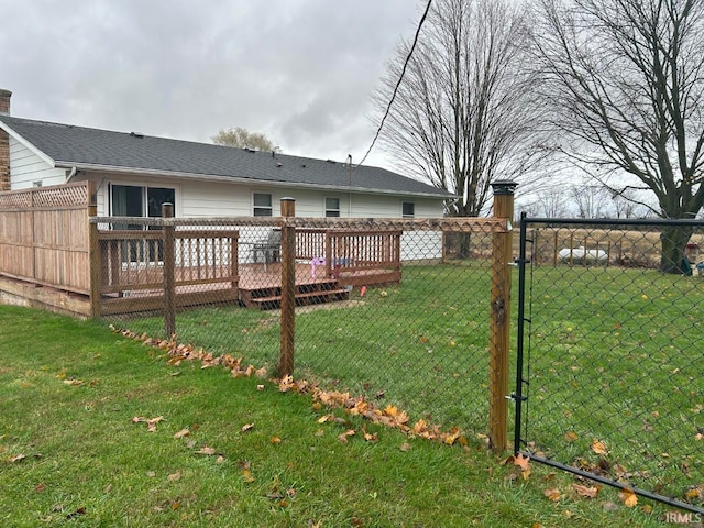 view of yard with a wooden deck