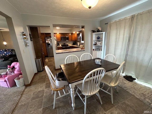 dining room with a textured ceiling