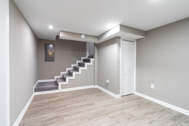 basement featuring light hardwood / wood-style flooring