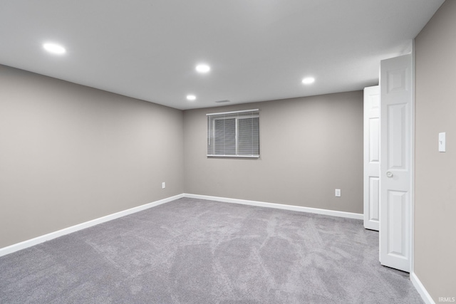 empty room with light colored carpet