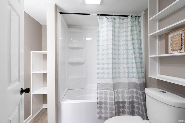 bathroom with shower / tub combo with curtain, wood-type flooring, a textured ceiling, and toilet