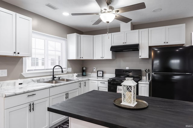 kitchen with white cabinetry, sink, ceiling fan, and black appliances