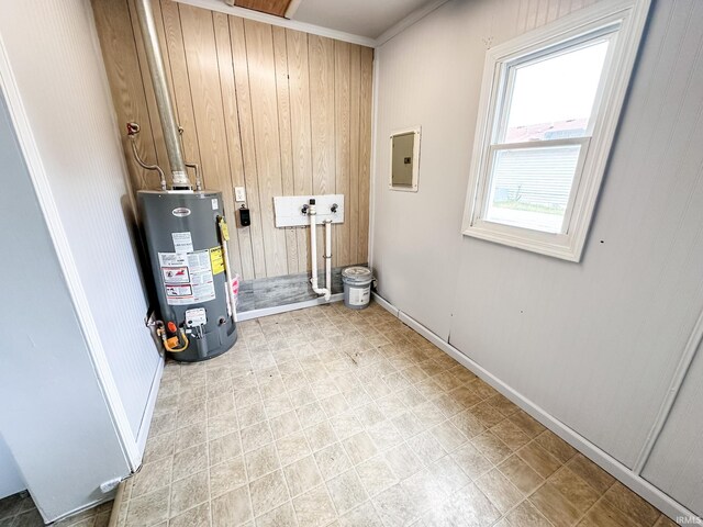 utilities featuring electric panel and gas water heater