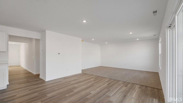 spare room with light hardwood / wood-style flooring