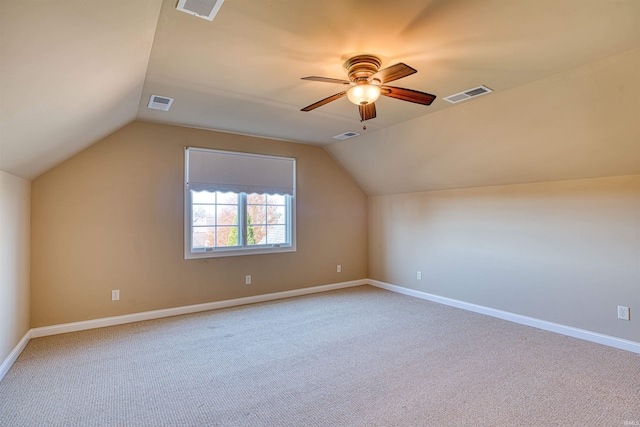 additional living space featuring carpet flooring, vaulted ceiling, and ceiling fan