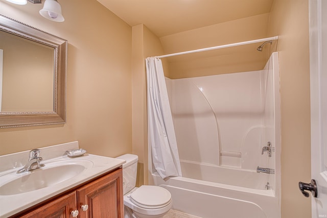 full bathroom with vanity, toilet, and shower / tub combo