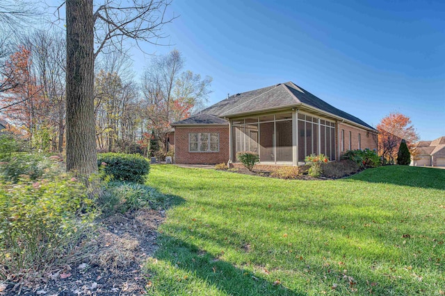 view of yard featuring a sunroom