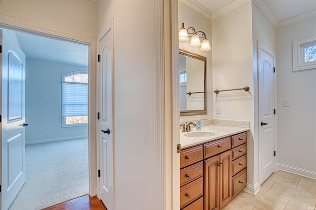 bathroom featuring vanity, tile patterned floors, and crown molding