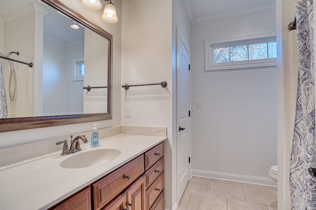 bathroom with tile patterned flooring, vanity, toilet, and crown molding