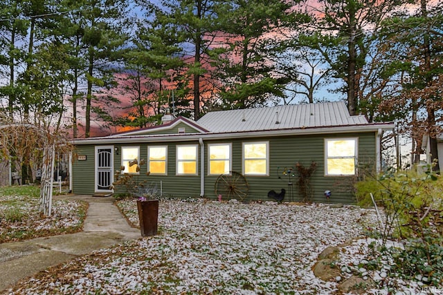 view of back house at dusk