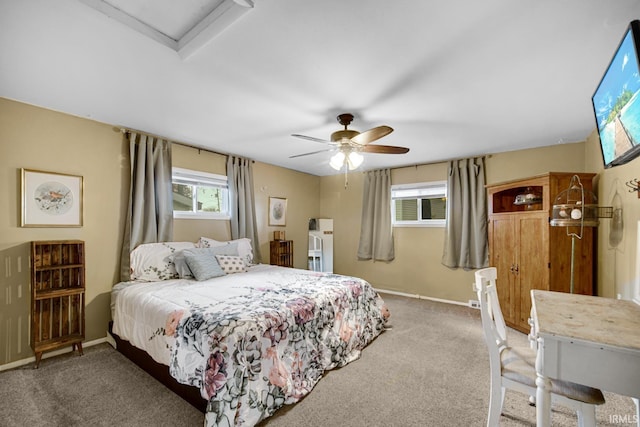 bedroom with ceiling fan and carpet floors