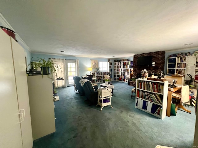 living room featuring carpet, crown molding, and a textured ceiling