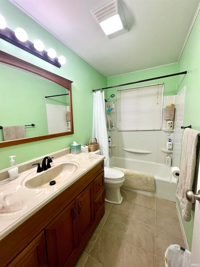 full bathroom featuring tile patterned floors, shower / bath combo with shower curtain, vanity, and toilet