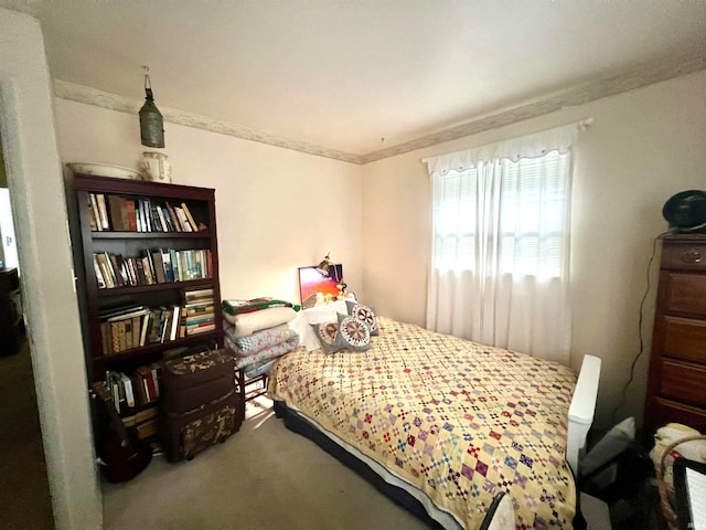 bedroom with carpet flooring and ornamental molding