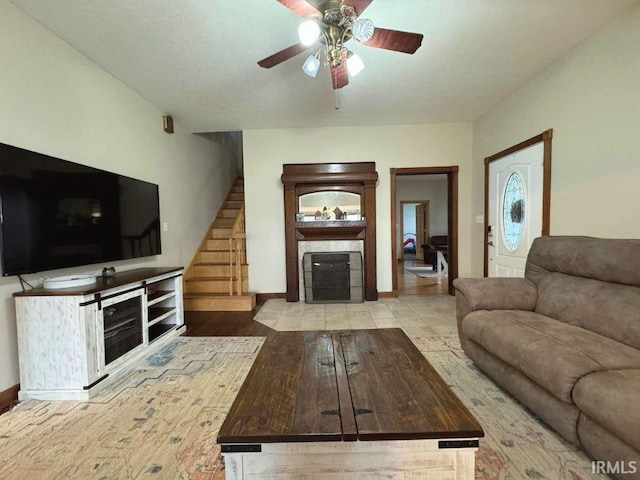 unfurnished living room with ceiling fan and light wood-type flooring