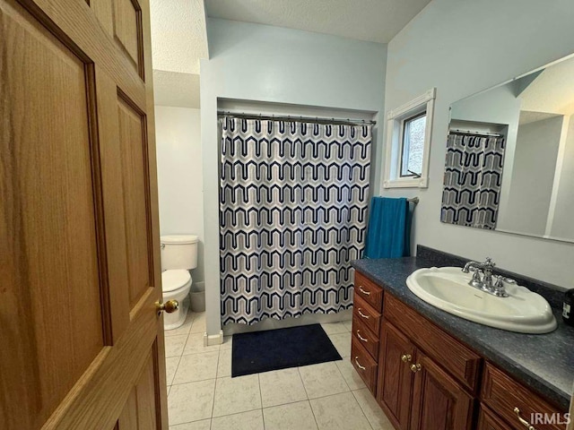 bathroom featuring tile patterned flooring, vanity, toilet, and a shower with shower curtain