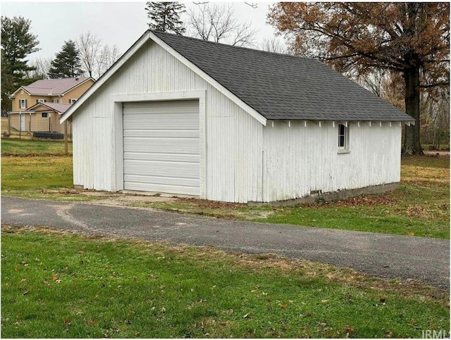 garage featuring a yard