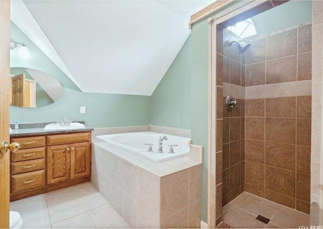 bathroom featuring tile patterned floors, vanity, lofted ceiling, and independent shower and bath