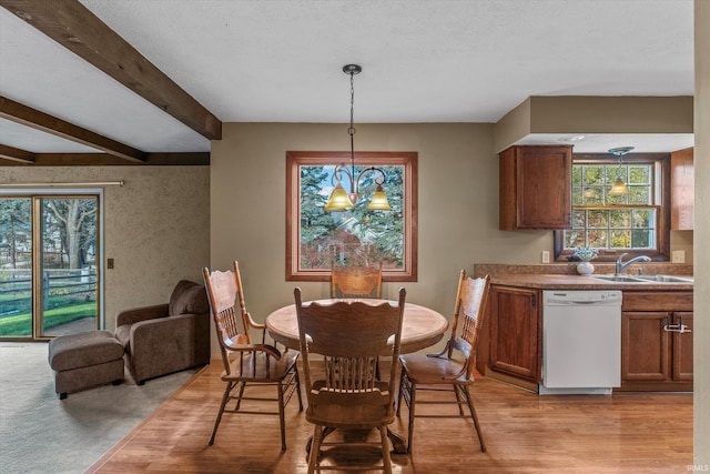 dining room featuring a textured ceiling, sink, light hardwood / wood-style flooring, beamed ceiling, and a chandelier