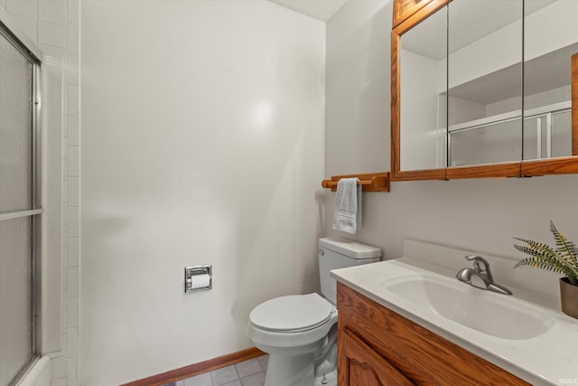 bathroom with vanity, toilet, and walk in shower